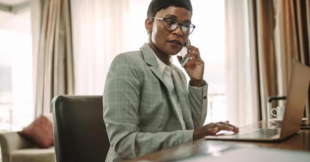 A woman searches her laptop for private stock investing opportunities.